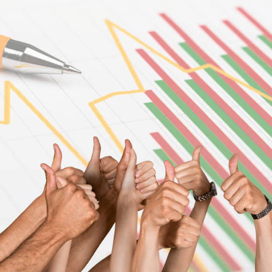 multiple thumbs up with a pen and graph background symbolizing learning seo basics